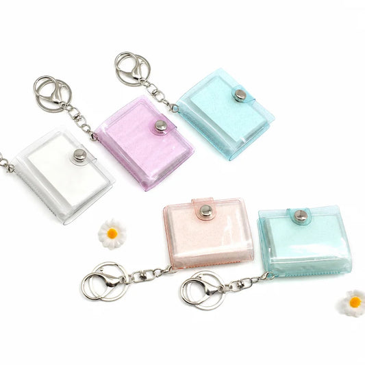 Blank mini photo album keychains in white, pink, blue and beige marbled glitter covers