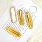 Blank pearl edged hair clips shown from the front and from the gold ribbed clip back