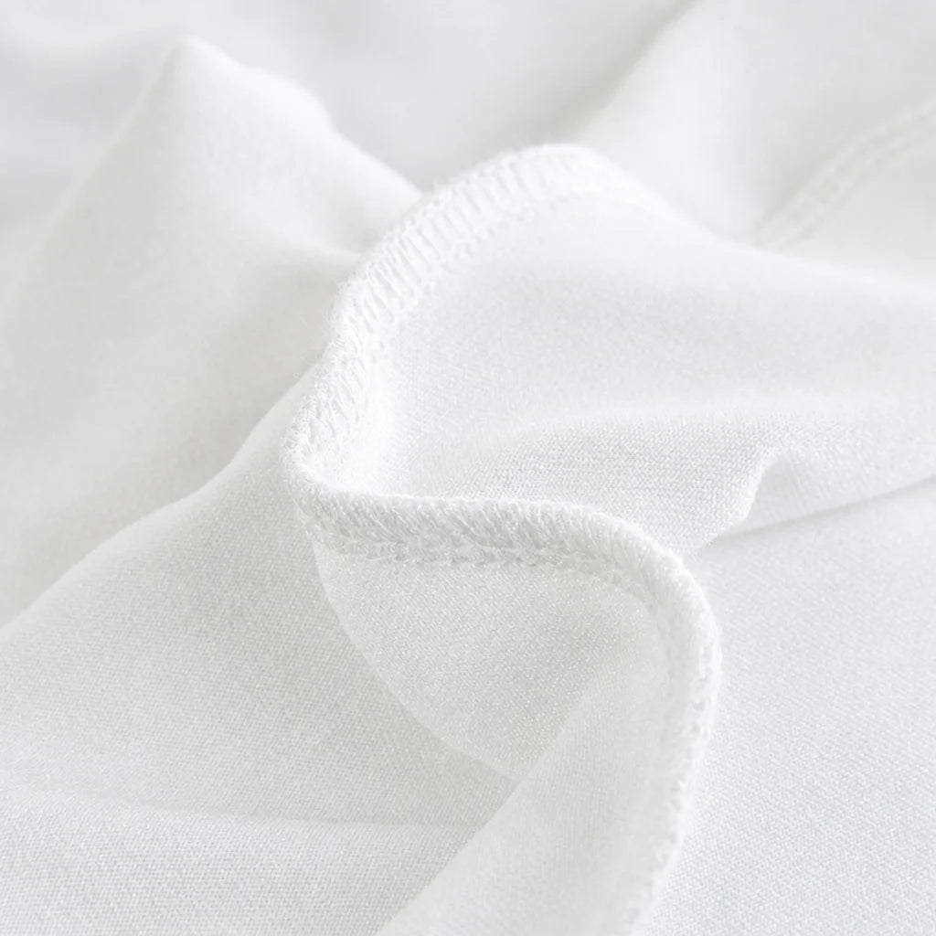 Close-up of the white polyester cover fabric and its overlock-stitched seam