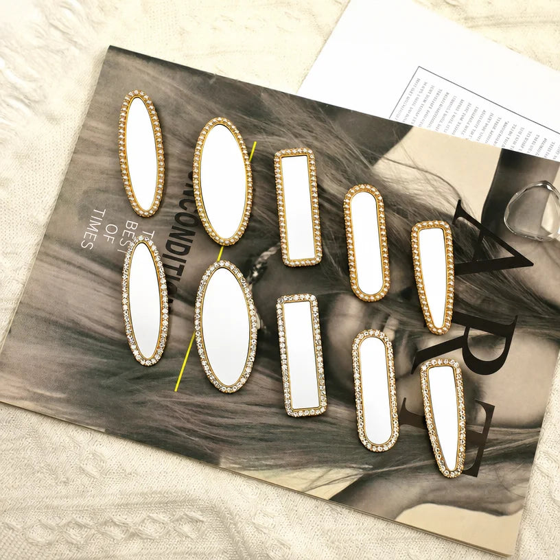 Ten blank metal hair clips in five shapes with rhinestone and pearl edging