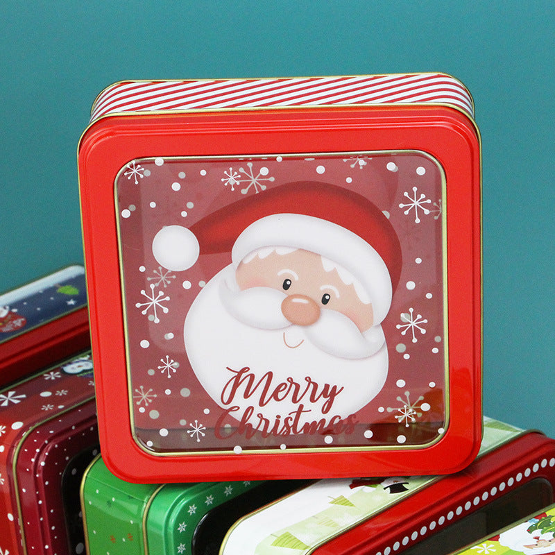 Square red tin box with a window lid showing a Santa and Merry Christmas design
