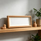 Walnut wood rectangular frame on a console