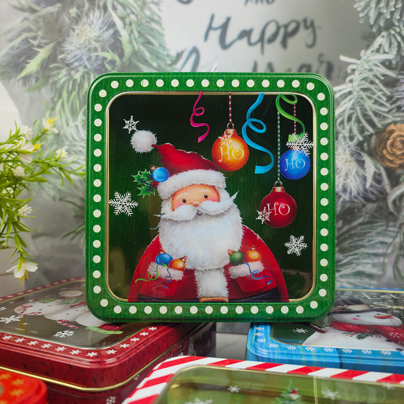 Green square tin box with a window lid showing a Santa with baubles design