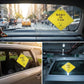 The printed sample sign mounted on car windows in three different vehicles