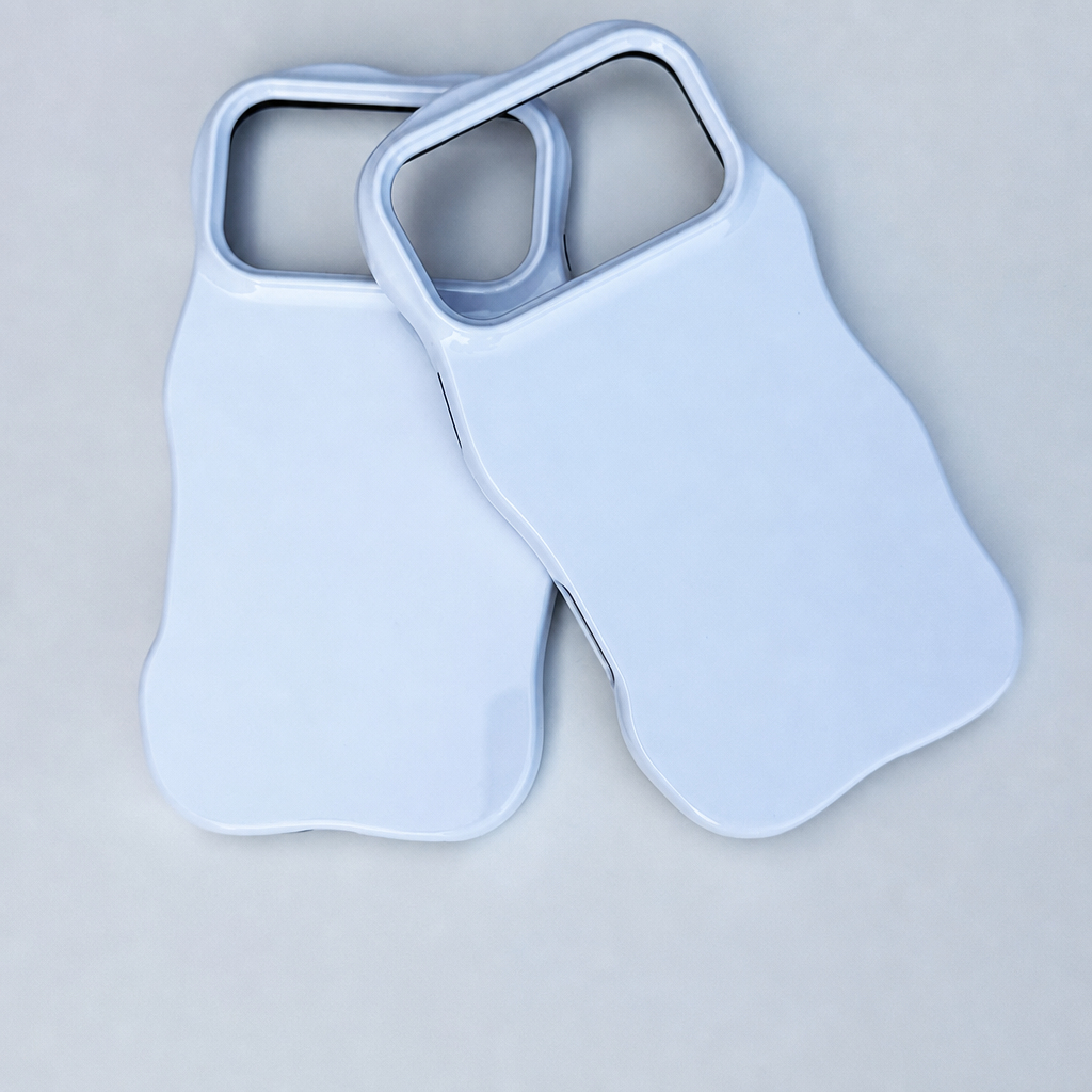 Two blank wavy two-in-one phone cases on a light background