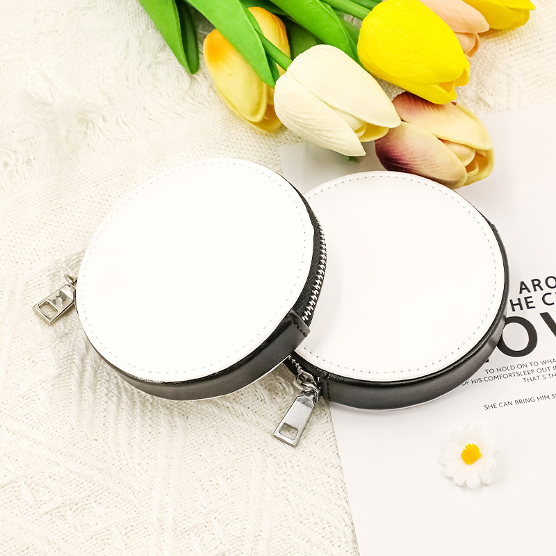 Two blank white PU leather pouch keyrings on a soft grey background