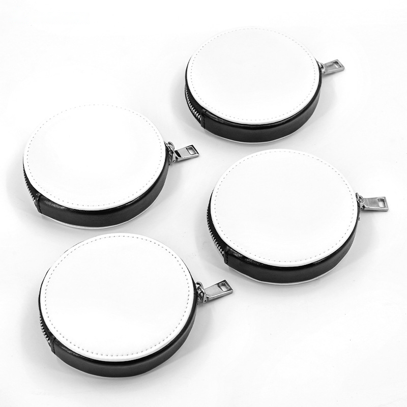 Four blank white PU leather mini storage pouch keyrings on a plain white background