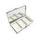 Open metal pill box showing the mirror in the lid and three empty compartments